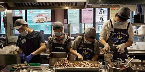 Located smack in the middle of Hong Kong's bustling Mong Kok neighborhood, Dignity Kitchen offers an array of mouthwatering Singaporean fare. (Photo | AP)