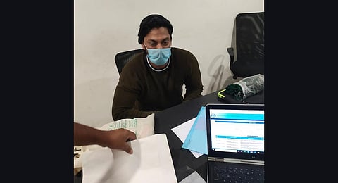 Prime accused Indra Kumar being questioned by cops at his office on Cunningham Road. (Photo | Special Arrangement)