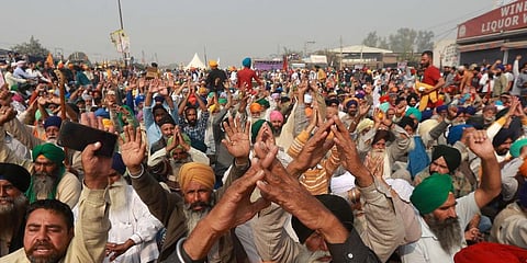 Farmers shouting slogans during their Delhi Chalo protest march against the new farm laws at Singhu border in New Delhi on Sunday. (Photo | Shekhar Yadav, EPS)