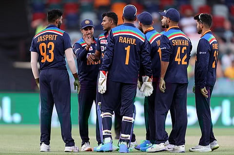 Indian team players celebrate a wicket of Australian batsman. (Photo | AFP)