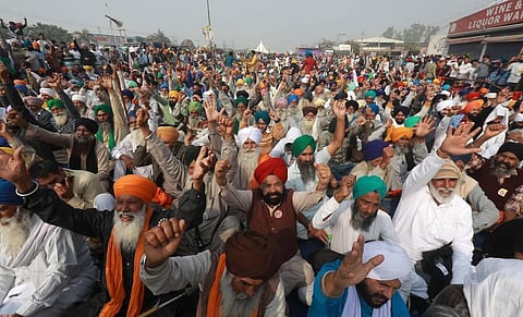 Farmers shouting slogans during their Delhi Chalo protest march against the new farm laws at Singhu border in New Delhi on Sunday. (Photo | Shekhar Yadav/EPS)
