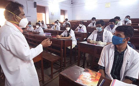 With colleges reopening after several months due to the Covid-19 pandemic, students are seen attending classes physically at Madurai Medical College on Monday (Express Photo | KK Sundar)
