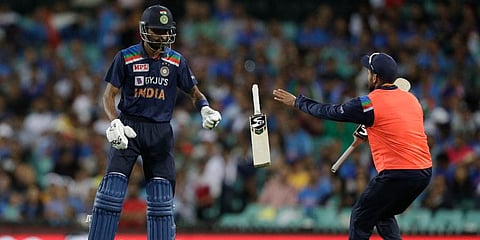 India's Hardik Pandya tosses his bat towards his teammate to exchange it during the second T20 international cricket match against Australia. (Photo |  AP)
