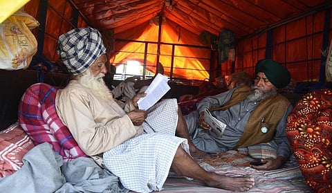 Farmers at Singhu border during their ongoing protest against the Centres farm reform laws in New Delhi Tuesday. (Photo | Parveen Negi, EPS)