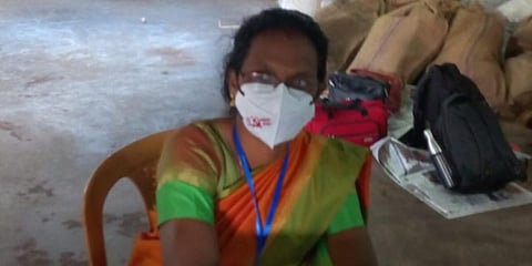 The presiding officer, who was on election duty at the Jhon's Cashew Company polling booth 1 in Kottamkara gram panchayat, was wearing a mask with CPM symbol. (photo| Special Arrangement)