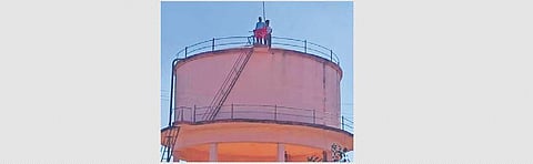 The two farmers who climbed atop a water tank at Narsampet mandal in Warangal Rural district  on Tuesday