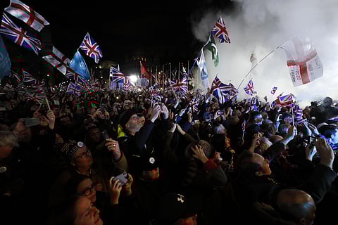 Brexit supporters celebrate during a rally in London on Friday after it was officially declared. (photo| AP)