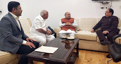 Karnataka CM BS Yediyurappa and his son BY Vijayendra meet senior BJP leaders Amit Shah and JP Nadda in New Delhi on Friday. (Photo| EPS)