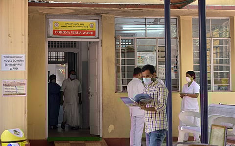 Officials monitor patients in the isolation ward set up at Rajiv Gandhi Institute of Chest Diseases in Bengaluru on Friday. (Photo| Meghana Sastry, EPS)