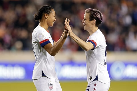 US forwards Lynn Williams (L) and Megan Rapinoe celebrate former's goal against Panama during CONCACAF women's Olympic qualifying match. (Photo | AP)