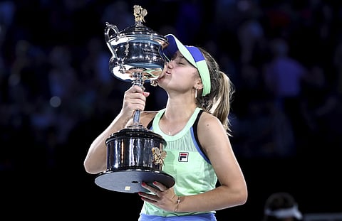 Sofia Kenin of the US the trophy after defeating Spain's Garbine Muguruza in the women's singles final at the Australian Open tennis championship in Melbourne. (Photo | AP)