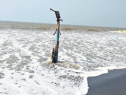 A tube-well devoured by the sea in Satabhaya | Express