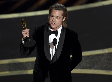 Brad Pitt accepts the award for best performance by an actor in a supporting role for 'Once Upon a Time in Hollywood' at the Oscars. (Photo | AP)