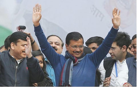 Delhi CM Arvind Kejriwal greets supporters after the landmark victory in Delhi elections at party headquarters in New Delhi on Tuesday. (Photo | EPS/Shekhar Yadav)