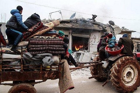 Members of a Syrian family fleeing attacks by pro-regime force. (Photo | AFP)