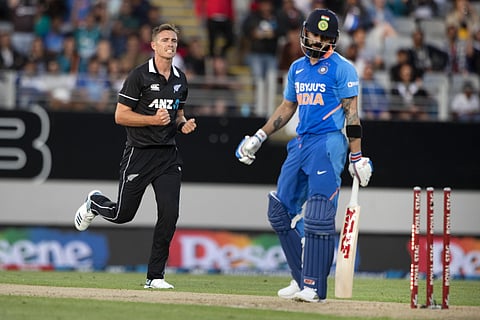 New Zealand bowler Tim Southee (L) celebrates the wicket of India's Virat Kohli during the 3rd ODI between India and New Zealand at Eden Park in Auckland on Saturday. (Photo| AP)