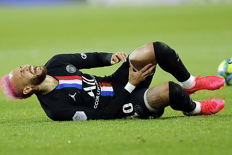 PSG's Neymar lies on the ground during the French League One match against Montpellier. (Photo | AP)