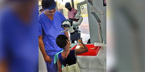 A child attempts a mock surgery on a brain specimen at National Institute of Mental Health and Neuro Sciences in Bengaluru on Wednesday | Express
