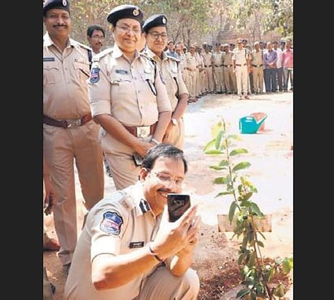 CP VC Sajjanar takes a selfie after planting a sapling at the Cyberabad parade ground on Friday