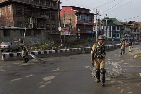 In this Wednesday, Aug. 7, 2019, file photo, Indian paramilitary soldiers drag barbwire as they prepare to impose curfew in Srinagar. (Photo | AP)