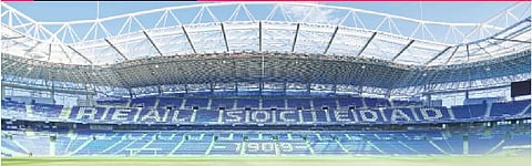 (Left) Real Sociedad players having a light moment during a training session. The changing rooms for the players at Athletic Bilbao’s San Mames Stadium (top right) and SD Eibar’s Ipurua Municipal Stadium