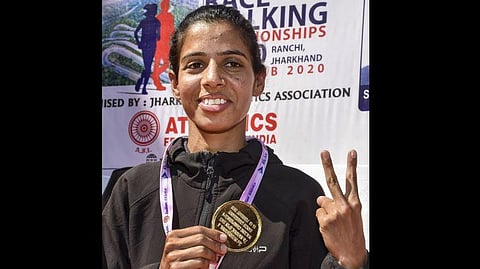 Athlete Bhavna Jaat who made a national record and qualified for Tokyo Olympic 2020 poses with her Gold Medal during the 7th National Race/Walk Championships 2020 in Ranchi Jharkhand Sunday Feb. 16 2020. (Photo | PTI)