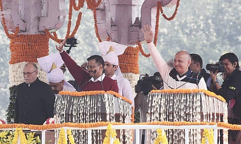 Delhi CM Arvind Kejriwal (L) and minister Manish Sisodia during an oath-taking  ceremony at Ramlila Ground in New Delhi on Sunday. (Photo| Parveen Negi, EPS)