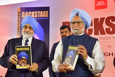 Former prime minister Manmohan Singh with former deputy chairperson of the erstwhile Planning Commission Montek Singh Ahluwalia (L) launches the latter's book 'Backstage: The Story Behind India's High Growth Years' at a function in New Delhi Wednesday Feb