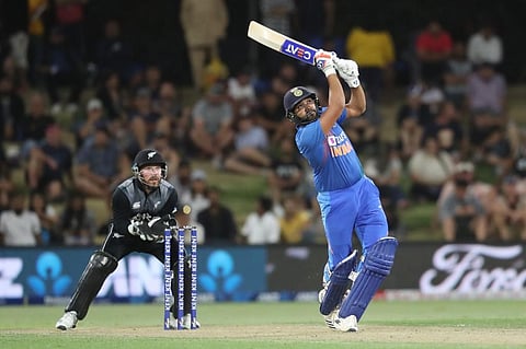 Rohit Sharma (R) bats watched by New Zealand’s Tim Seifert (L) during the fifth Twenty20 cricket match. (Photo | AFP)