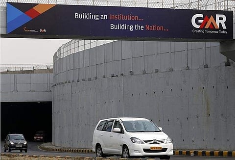 Vehicles cross through an underpass constructed by GMR Infrastructure that connects to the airport in New Delhi, May 13, 2013. (File | Reuters)