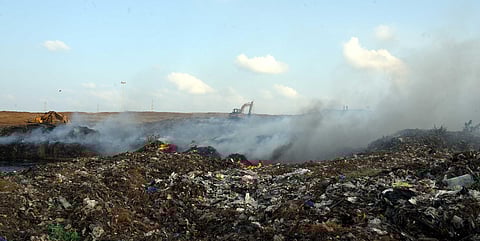 Due to a major fire-breakout at the Kodungaiyur dumpyard, thick smoke engufled the surrounding areas affecting commuters and residents nearby severely. (Photo | Martin Louis, EPS)