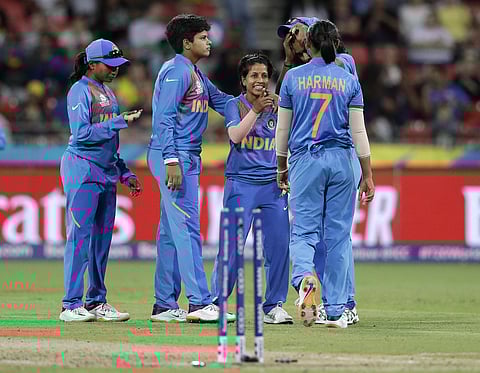 Player of the Match Poonam Yadav (C) registered 4/19 against Australia. (Photo | AP)