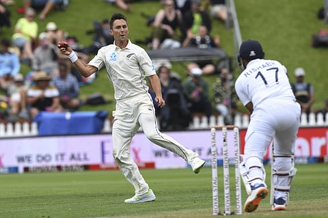 New Zealand's Trent Boult fields off his own bowling from India's Rishabh Pant during the first Test in Wellington. (Photo | AP)