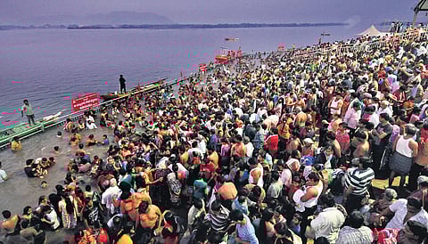 A procession of ‘prabhalu’ taken out at Yanamalakuduru; people queue up at the Kotappakonda hill shrine. (Photo | Prasant Madugula, EPS)