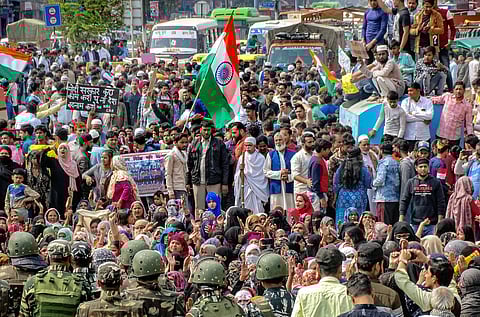 Protestors raise slogans during a demonstration against Citizenship Amendment Act (CAA), National Register of Citizens (NRC) and National Population Register (NPR), at Chand Bagh area, in East Delhi, Sunday. (Photo | PTI)