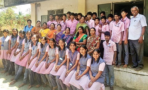 The children pose with their teachers and school staff | EXPRESS