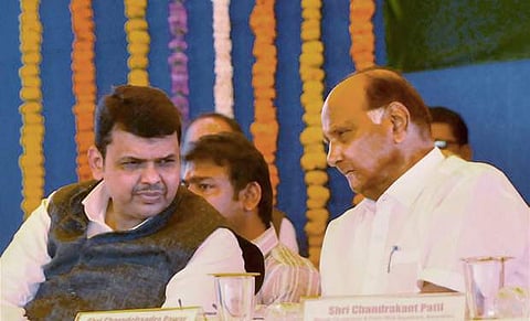 Maharashtra Chief Minister Devendra Fadnavis with NCP chief Sharad Pawar.
