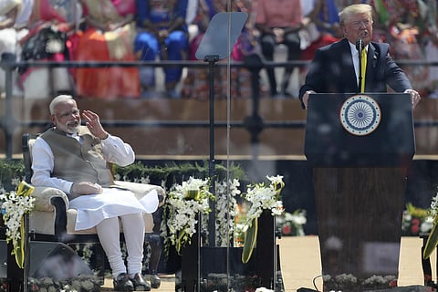 US President Donald Trump speaks, with Prime Minister Narendra Modi seated at Sardar Patel Stadium in Ahmedabad. (Photo| AP)