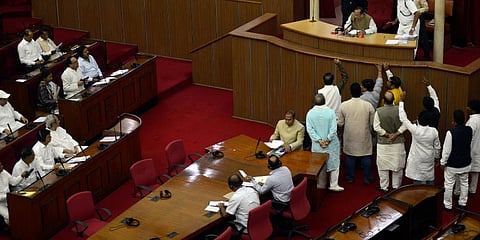 Congress MLAs staging protest in the well of the House in Bhubaneswar on Monday.