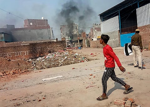 Smoke rises after miscreants set fire to a shop during clashes over the new citizenship law at Karawal Nagar area of East Delhi Tuesday Feb. 25 2020. (Photo | PTI)
