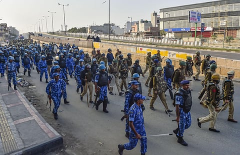 Security personnel conduct flag march during clashes between those against and those supporting the Citizenship Amendment Act in north east Delhi Tuesday Feb. 25 2020. (Photo | PTI)
