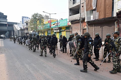 Security personnel patrol streets following clashes over the new citizenship law in Maujpur area of northeast Delhi Wednesday Feb. 26 2020. (Photo | PTI)