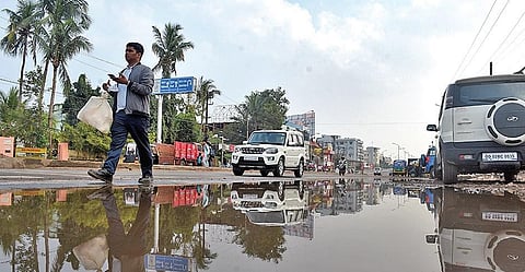 A waterlogged road near Bomikhal in Bhubaneswar on Wednesday. (Photo | EPS)