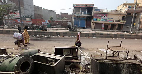 Muslims leave a riot-affected area after clashes at Khajuri Khas area in New Delhi on Wednesday. (Photo | Shekhar Yadav/EPS)