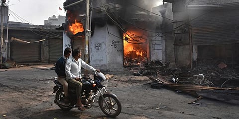 The petrol pump was the centre of attention as mediapersons went around talking to employees and hearing their ordeal. (Photo | AP)