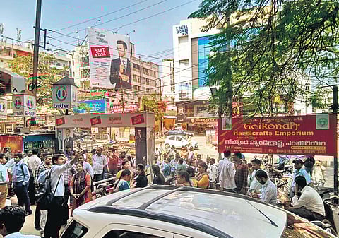 People wait outside Minerva Complex on Thursday after some vibrations created fears that the building would collapse