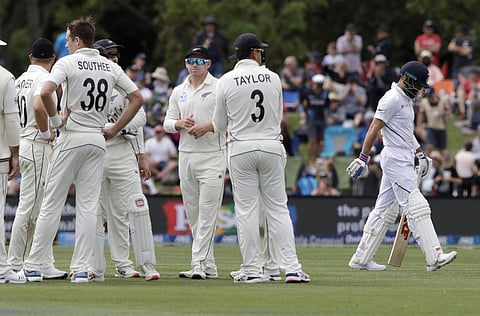 India's Virat Kohli walks from the field after he was dismissed by New Zealand's Tim Southee, left, for three runs. (Photo | AP)