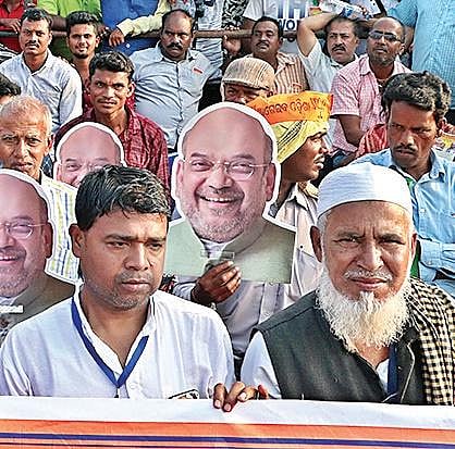 Supporters of BJP carrying masks of Home Minister Amit Shah at Janata Maidan