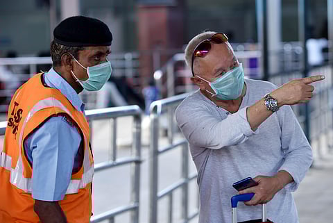 Passenegers arrving with face mask to avoid Corona Virus at Chennai International Airport in Chennai on Sunday. (Photo | R Satish Babu/EPS)