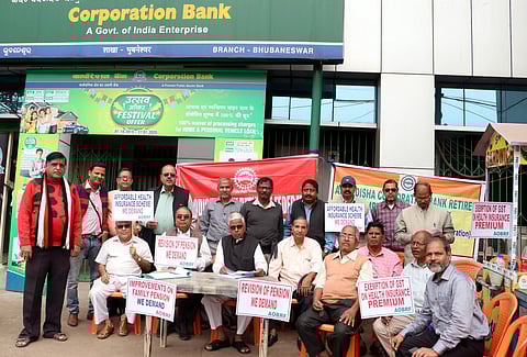 Members of All Odisha Bank Retirees’ Federation staging dharna in Bhubaneswar on Monday. (Photo| Irfana, EPS)